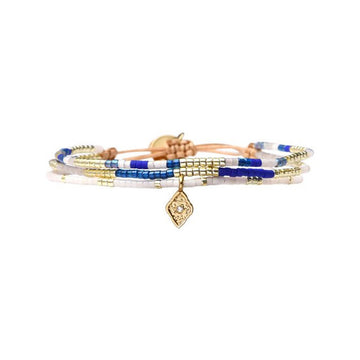 Multistrand bracelet with blue, white, and gold beads on a white background.