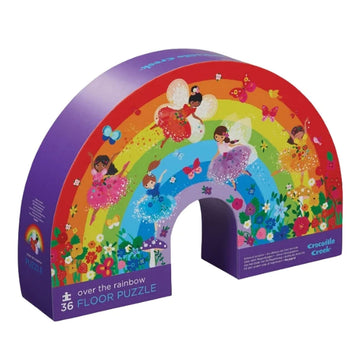 A puzzle box shaped like a rainbow with an illustration of a rainbow with fairies.