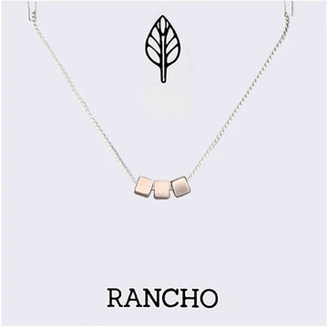 Necklace with geometric cube pendants on a white background with 'RANCHO' branding.