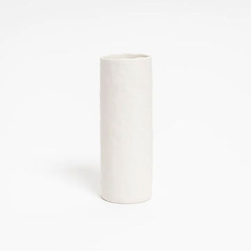 A tall cylinder vase in white ceramic.