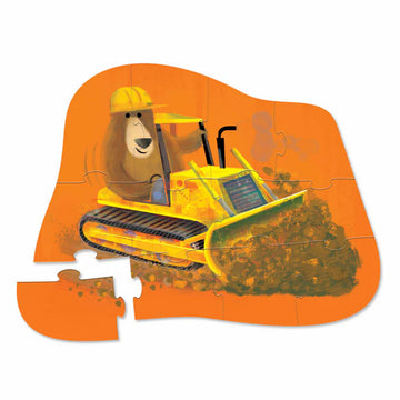 Puzzle box with a cartoon bulldozer and bear character on an orange and blue background.