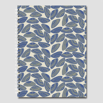 A spiral bound notebook with a repeating pattern of pipi shells in blue and green.