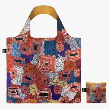A tote bag printed with artwork by Ada Dixon with red square and circles over a coloured background. There is a matching pouch next to the bag.
