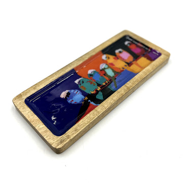 A wooden rectangular tray printed with artwork by Karen Barnes inside.