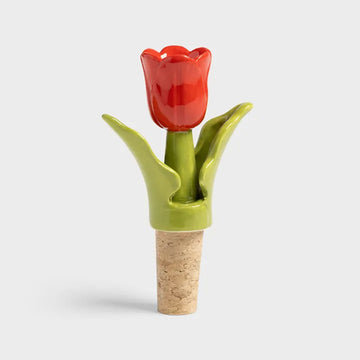 Red tulip-shaped bottle stopper on a white background.