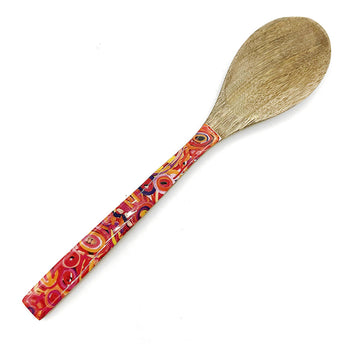 A wooden serving spoon printed with artwork by Cedric Varcoe on the handle.