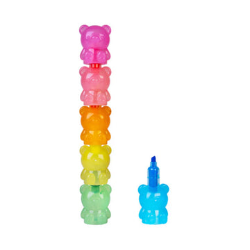 A stack of bear shaped highlighters in different colours with one next to the stack.