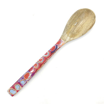 A wooden serving spoon printed with artwork by Muride Morris on the handle.