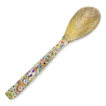 A wooden serving spoon printed with artwork by Cedric Varcoe on the handle.