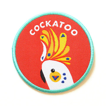 A woven fabric patch with an illustration of a cockatoo and the text 'Cockatoo' at the top.