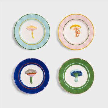 Four colorful plates with mushroom designs on a light gray background.