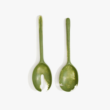 A set if salad servers in olive green resin.