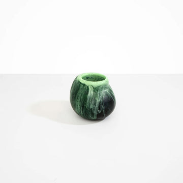 A small irregular shaped round vase in moss green.