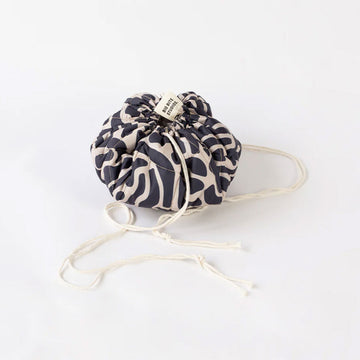 Fabric drawstring bag with a pattern on a white background.