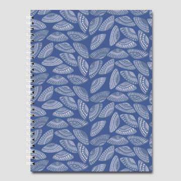 A spiral bound journal printed with a repeating pattern of pipi shells in blue and white.