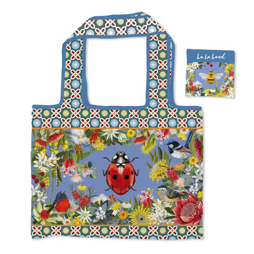 Colorful reusable tote bag with nature-themed design featuring a ladybug and flowers, accompanied by a matching pouch.