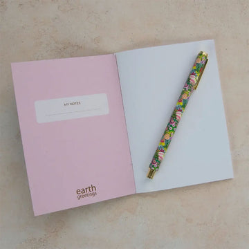 A notebook illustrated with flowers on a dark blue background.