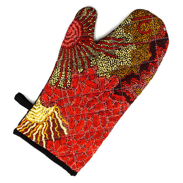 A single oven mitt printed with artwork by Damien and Yilpi Marks in shades of red and yellow.