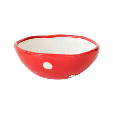 A bowl shaped like the top of a toadstool upside down.