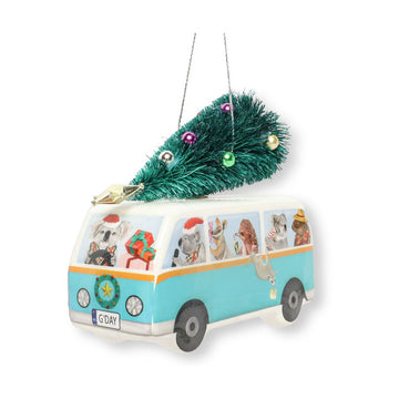 A Christmas decoration in the shape of a van with illustrated Australian animals inside and a Christmas tree on the top.