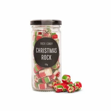 A clear jar filled with rock candy and the label Christmas Rock.