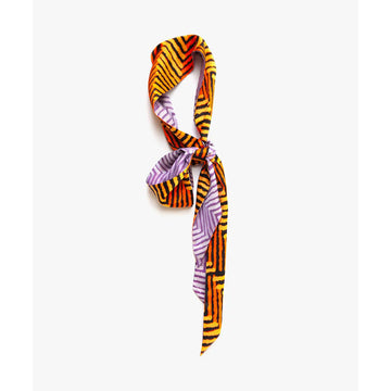 A twilly style scarf printed with a chevron pattern in orange on one side and a chevron pattern in purple on the other side.