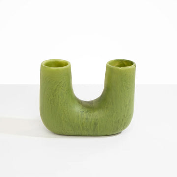 A U shaped vase in olive green resin.