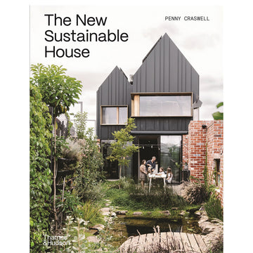 'The New Sustainable House' book cover featuring a photo of a small double storey house with a family around a table in the backyard.