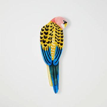 Wall art shaped like a yellow rosella.
