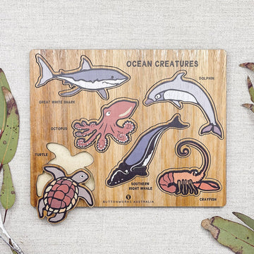 A puzzle board with pieces shaped like marine animals.