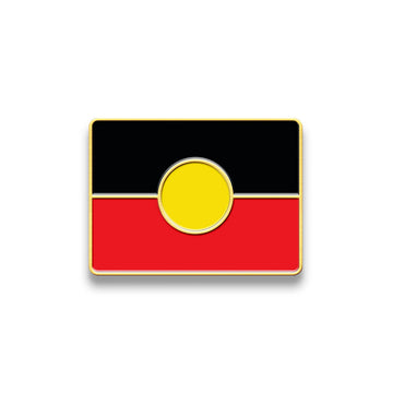 An enamel pin shaped and coloured like the Aboriginal flag.