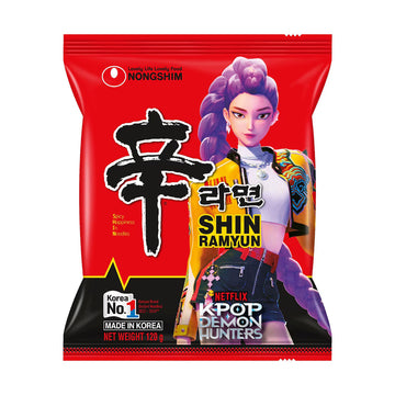 A packet of noodles with a red background, product information and image of a cartoon girl.