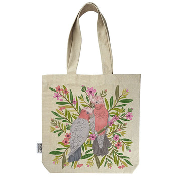 Tote bag with pink cockatoos and floral design on a beige background.
