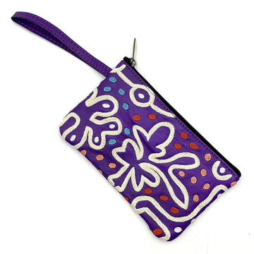 A purple leather pouch embroidered with a white design and colourful spots.