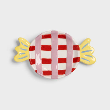 Candy-shaped dish with red and white checkered design on a light gray background.