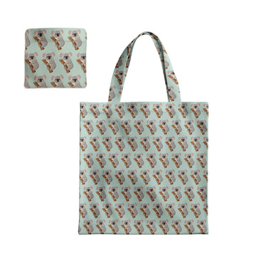 Tote bag and pouch with koala pattern on a light blue background.