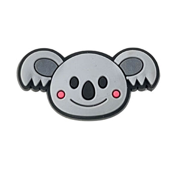 A rubber shoe charm shaped like a koala head.