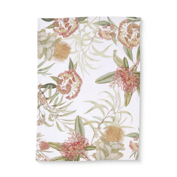 Floral patterned tea towel with pink and green flowers on a white background.