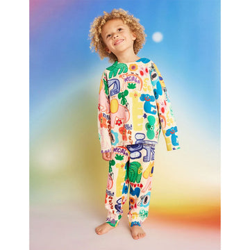 Colorful children's leggings with animal and abstract designs on a white background.