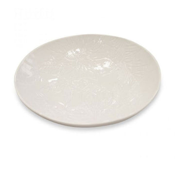 White ceramic plate with a subtle floral engraving on a white background.