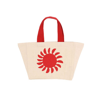 A beige tote bag with red handles and a red illustration of a sun.