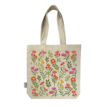A calico tote bag printed with colourful wildflowers.