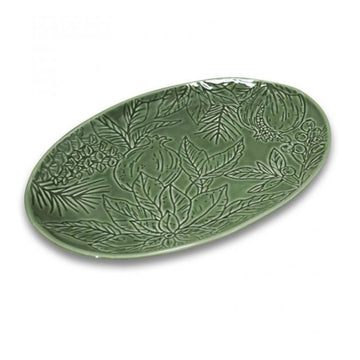 Green ceramic platter with leaf patterns on a white background.