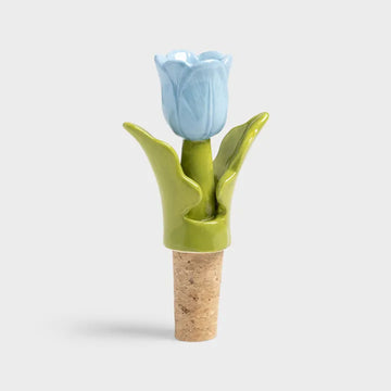 Ceramic tulip bottle stopper with blue flower and green leaves on a white background.