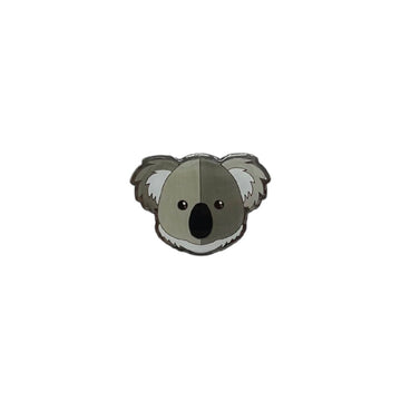 An enamel badge shaped like a koala head.