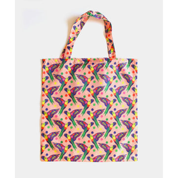 A reusable shopping bag in light orange illustrated with a repeat pattern of rainbow lorikeets.