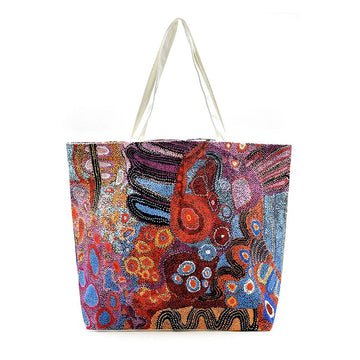 Colorful tote bag with abstract design on a white background.