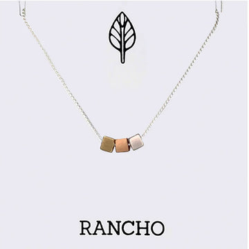 Necklace with geometric pendant on a white background, featuring the brand 'RANCHO'.