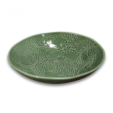 A green ceramic bowl engraved with leaves and fruits.