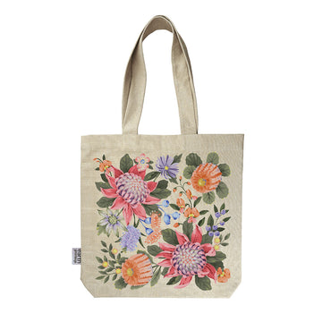 A calico tote bag printed with orange and pink flowers.